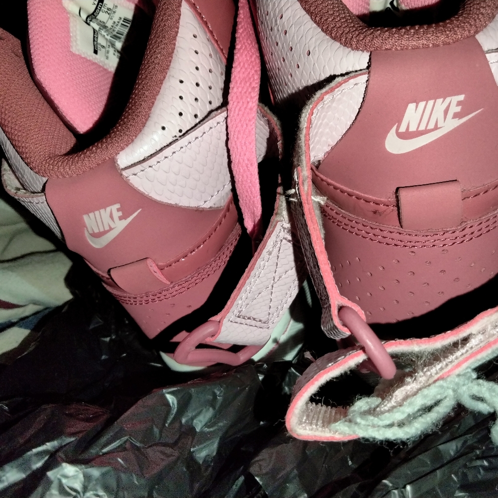 Dark pink in light pink Nikes shoes